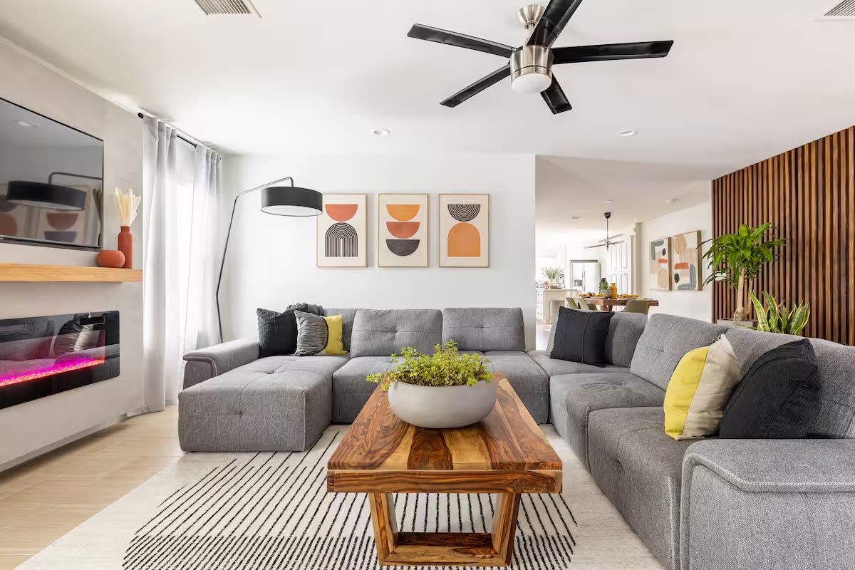 Stylish & Perfect for Families - Living Room With Fireplace Stylish & Perfect for Families living room with fireplace at a direct-booking vacation rental in Phoenix, Arizona