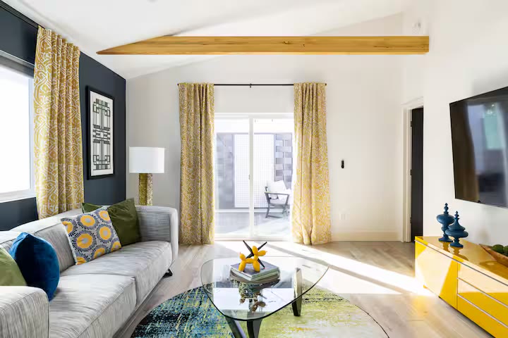 Modern All-En-Suite Home living room sofa at a direct-booking vacation rental in Phoenix, Arizona
