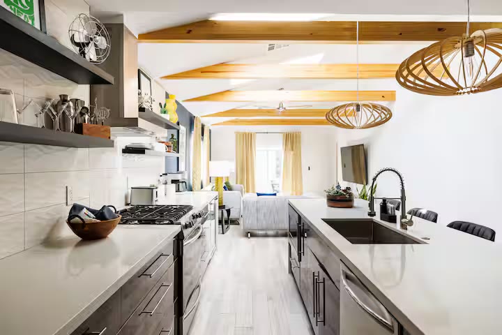 Modern All-En-Suite Home kitchen island seating at a direct-booking vacation rental in Phoenix, Arizona
