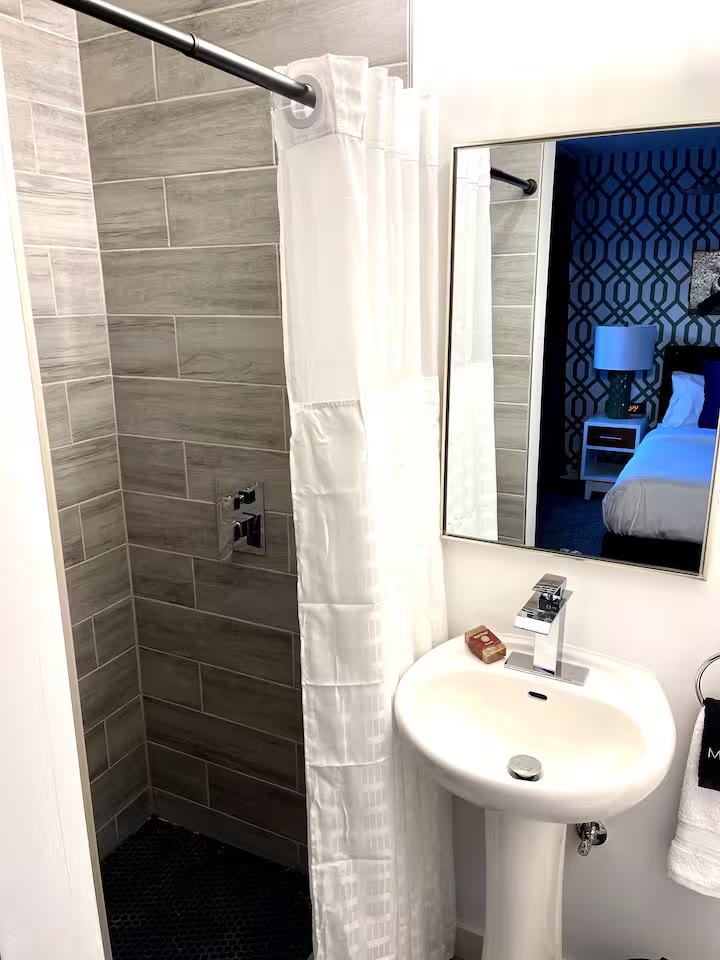 Modern All-En-Suite Home bathroom tile shower at a direct-booking vacation rental in Phoenix, Arizona