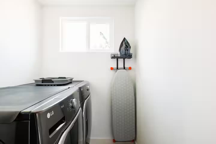 Modern All-En-Suite Home laundry room at a direct-booking vacation rental in Phoenix, Arizona