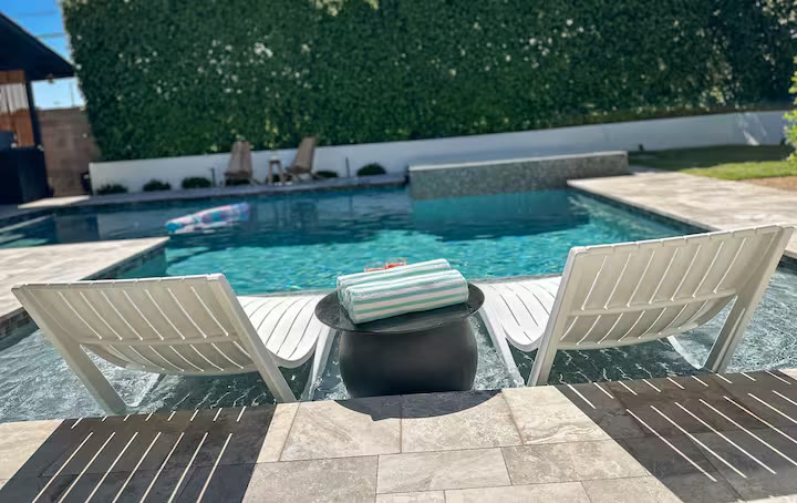 Palm Haven Pool House pool lounge seating at a direct-booking vacation rental in Phoenix, Arizona