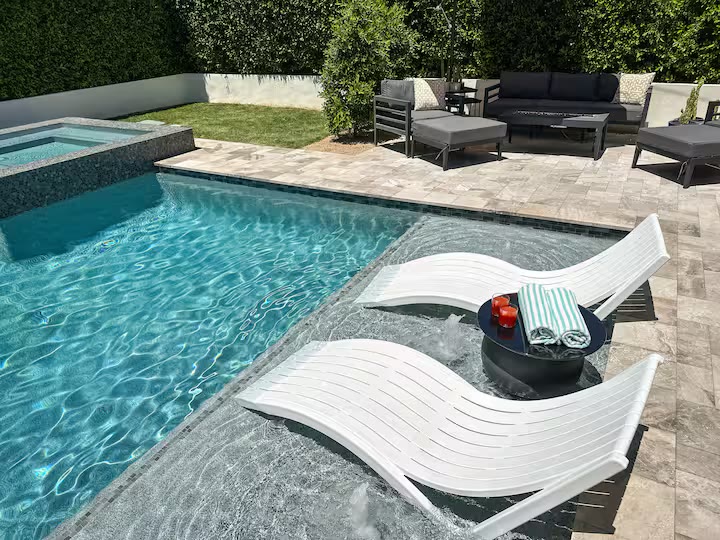 Palm Haven Pool House pool lounge chairs at a direct-booking vacation rental in Phoenix, Arizona