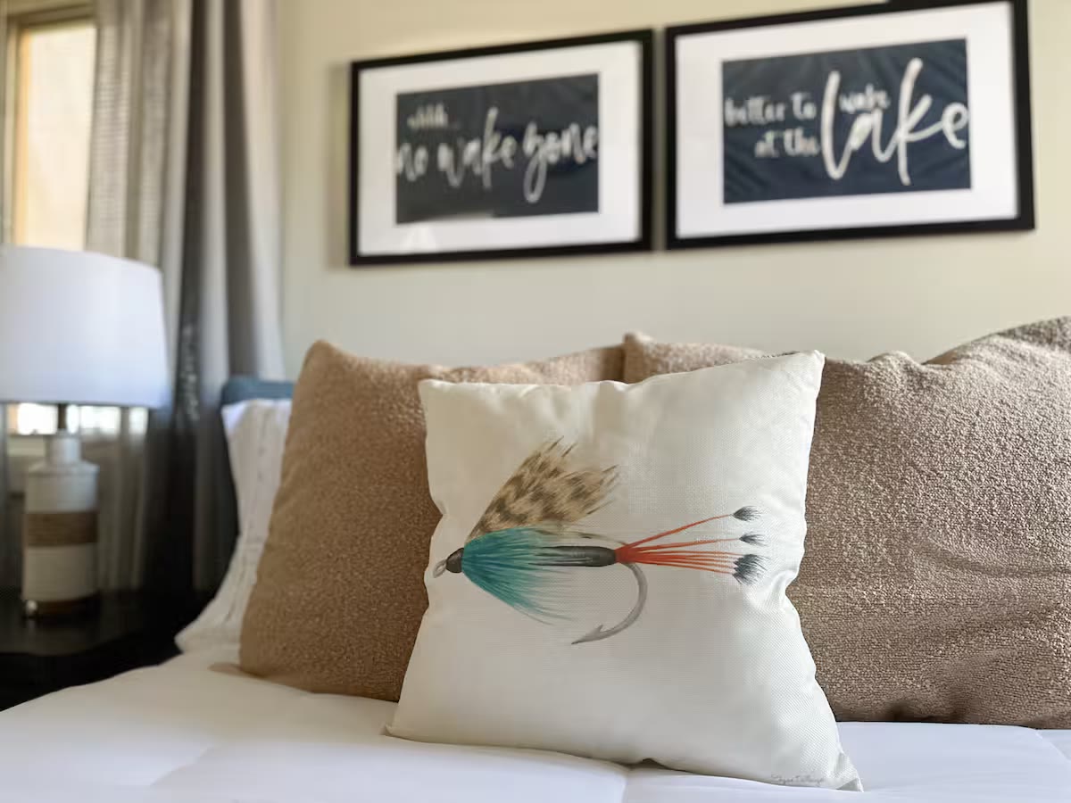 The Angler's Canoe Lake House guest bedroom at a direct-booking vacation rental in Cedar Bluff, Alabama