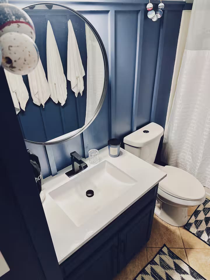 The Angler's Canoe Lake House bathroom vanity at a direct-booking vacation rental in Cedar Bluff, Alabama