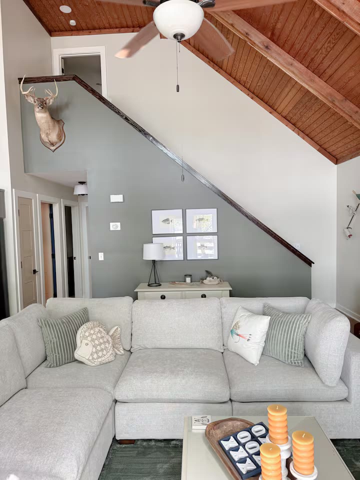 The Angler's Canoe Lake House living room fireplace at a direct-booking vacation rental in Cedar Bluff, Alabama