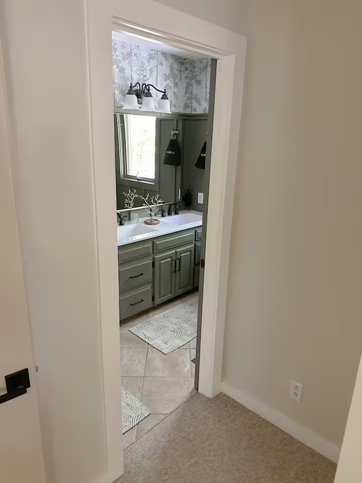 The Angler's Canoe Lake House bathroom shower at a direct-booking vacation rental in Cedar Bluff, Alabama