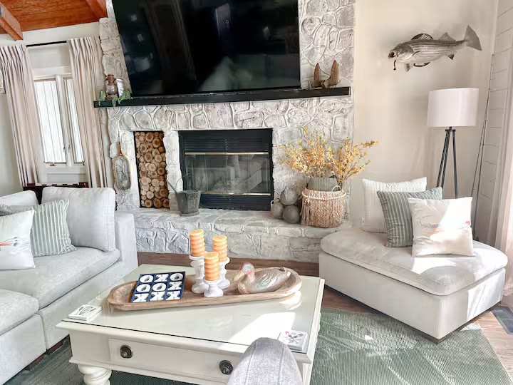 The Angler's Canoe Lake House living room seating at a direct-booking vacation rental in Cedar Bluff, Alabama