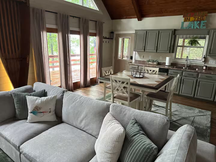 The Angler's Canoe Lake House open living room at a direct-booking vacation rental in Cedar Bluff, Alabama