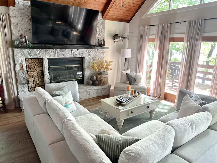 The Angler's Canoe Lake House living room windows at a direct-booking vacation rental in Cedar Bluff, Alabama