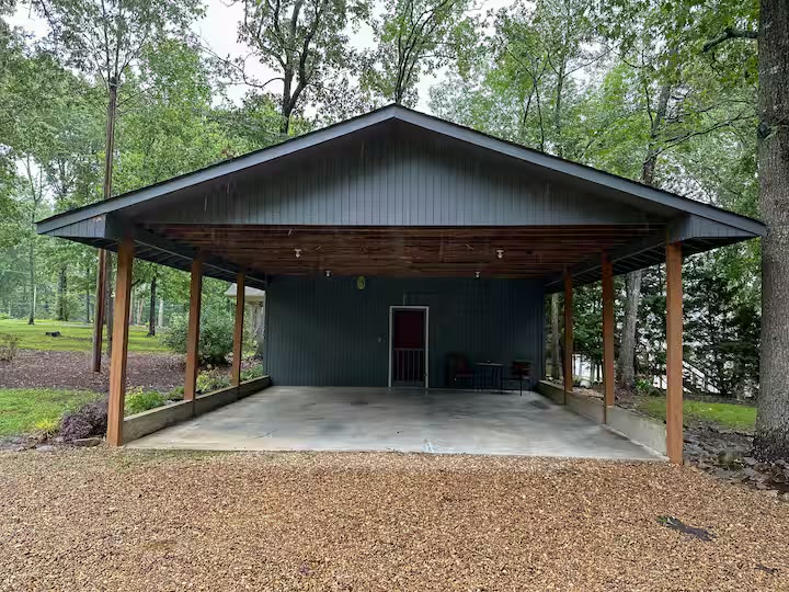 The Angler's Canoe Lake House cabin exterior side view at a direct-booking vacation rental in Cedar Bluff, Alabama