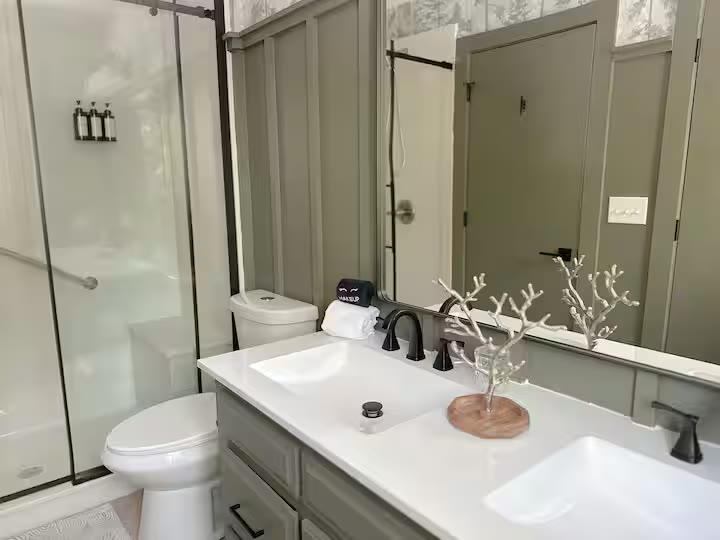 The Angler's Canoe Lake House bathroom shower at a direct-booking vacation rental in Cedar Bluff, Alabama