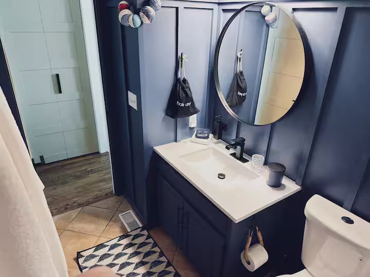 The Angler's Canoe Lake House bathroom shower at a direct-booking vacation rental in Cedar Bluff, Alabama