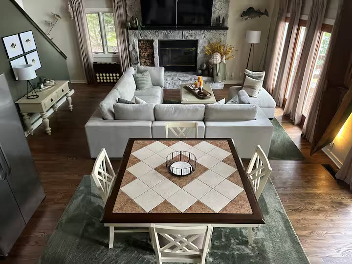 The Angler's Canoe Lake House living room sofa at a direct-booking vacation rental in Cedar Bluff, Alabama